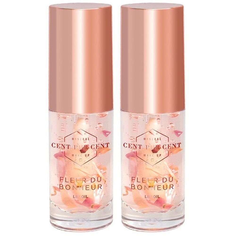 Twee flacons Cent Pur Cent Fleur du Bonheur Lip Oil met rozenblaadjes erin.