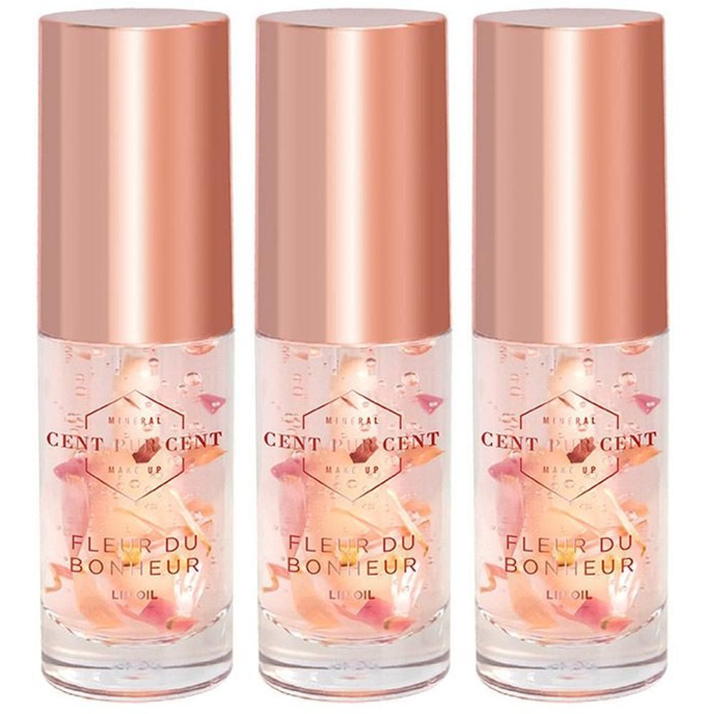Drie flacons Cent Pur Cent Fleur du Bonheur Lip Oil met rozenblaadjes.