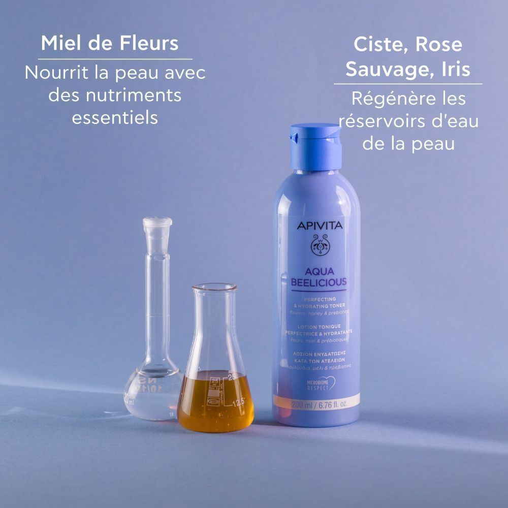 Lotion Apivita Aqua Beelicious avec équipement de laboratoire et miel.