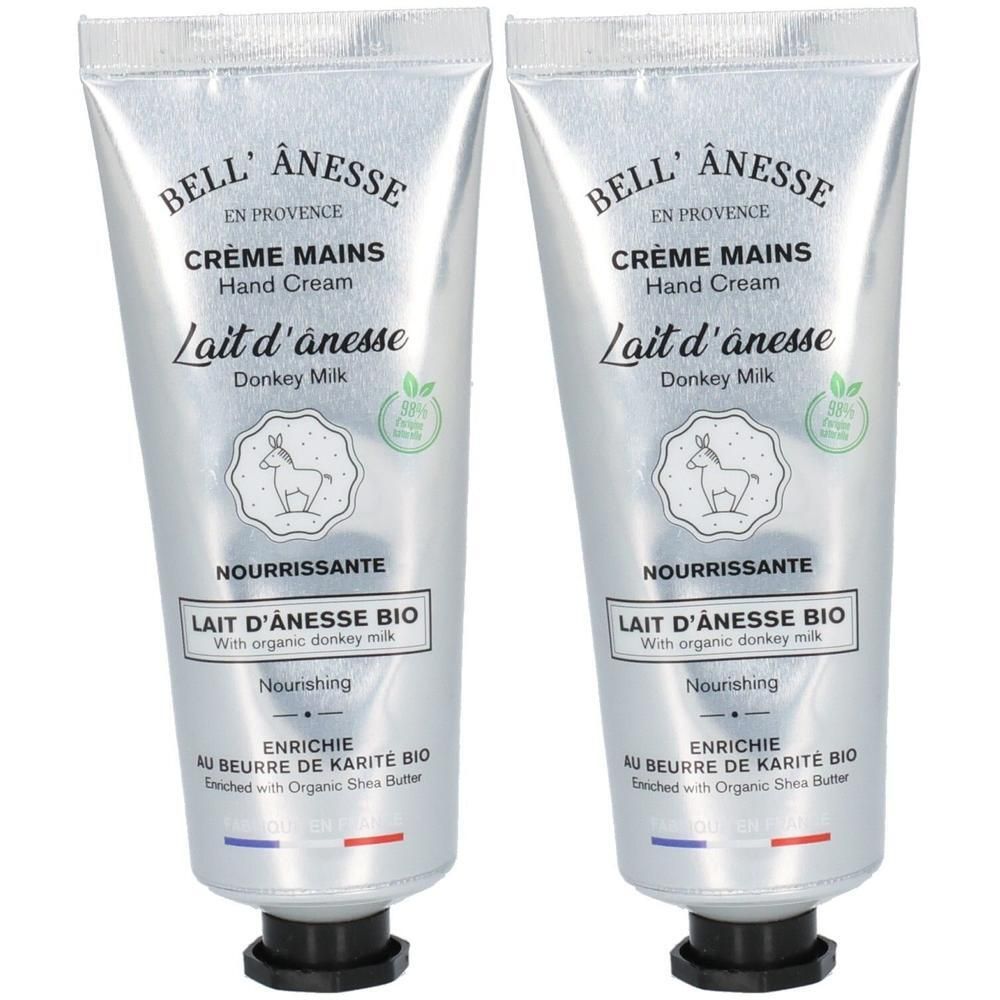 Twee zilverkleurige tubes handcrème met ezelinnenmelk en biologische sheaboter.