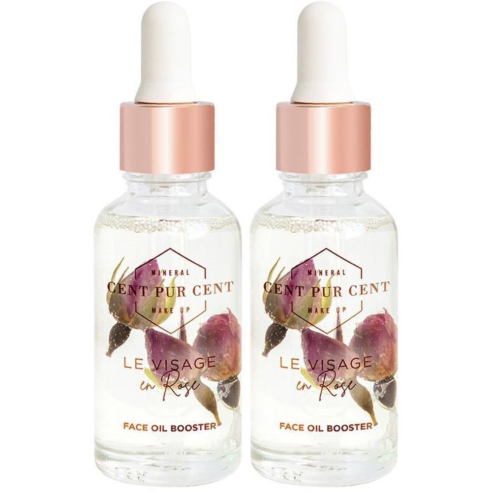 Twee flacons Cent Pur Cent Le Visage en Rose Face Oil Booster met rozenblaadjes.