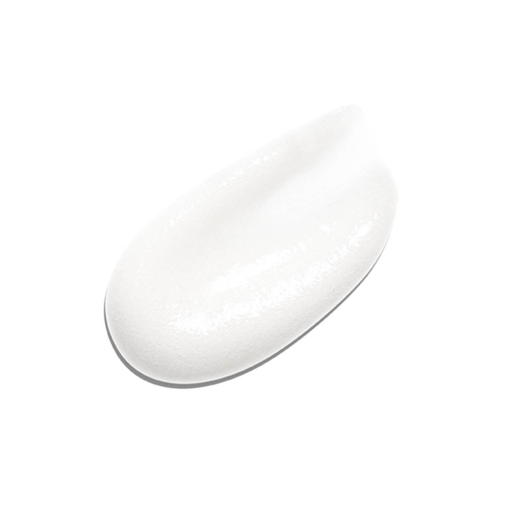 Een witte tandpastavlek op een witte achtergrond.