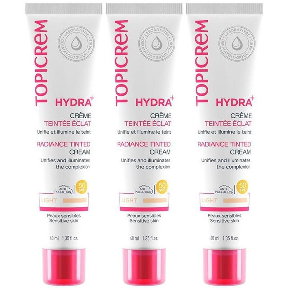Trois tubes de crème teintée Topicrem Hydra+, teinte Claire, SPF 50, peaux sensibles.