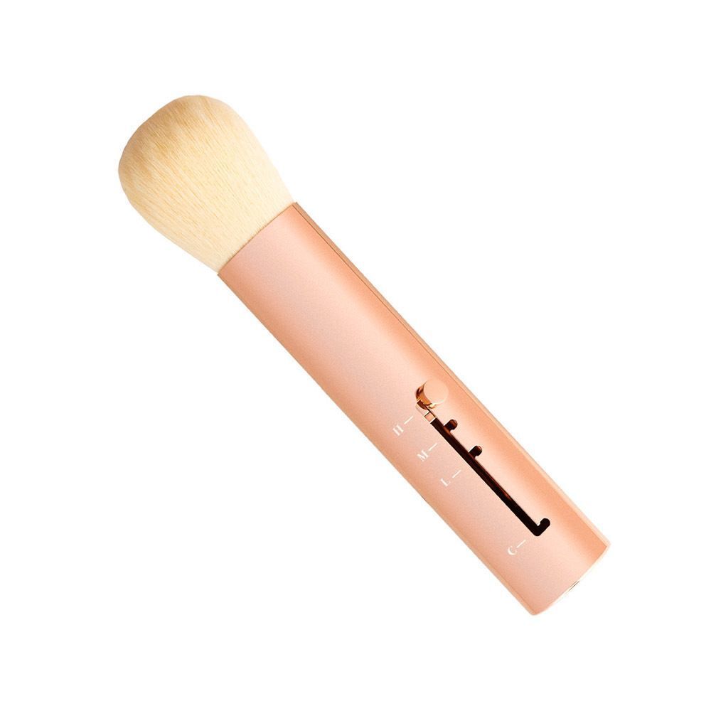Een intrekbaar penseel met roségouden handvat, witte borstelkop en instellingsmarkeringen.