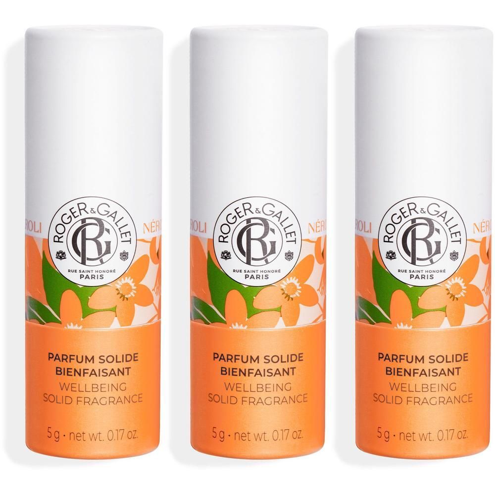 Trois sticks de parfum solide Roger&Gallet Neroli avec fleurs et feuilles.