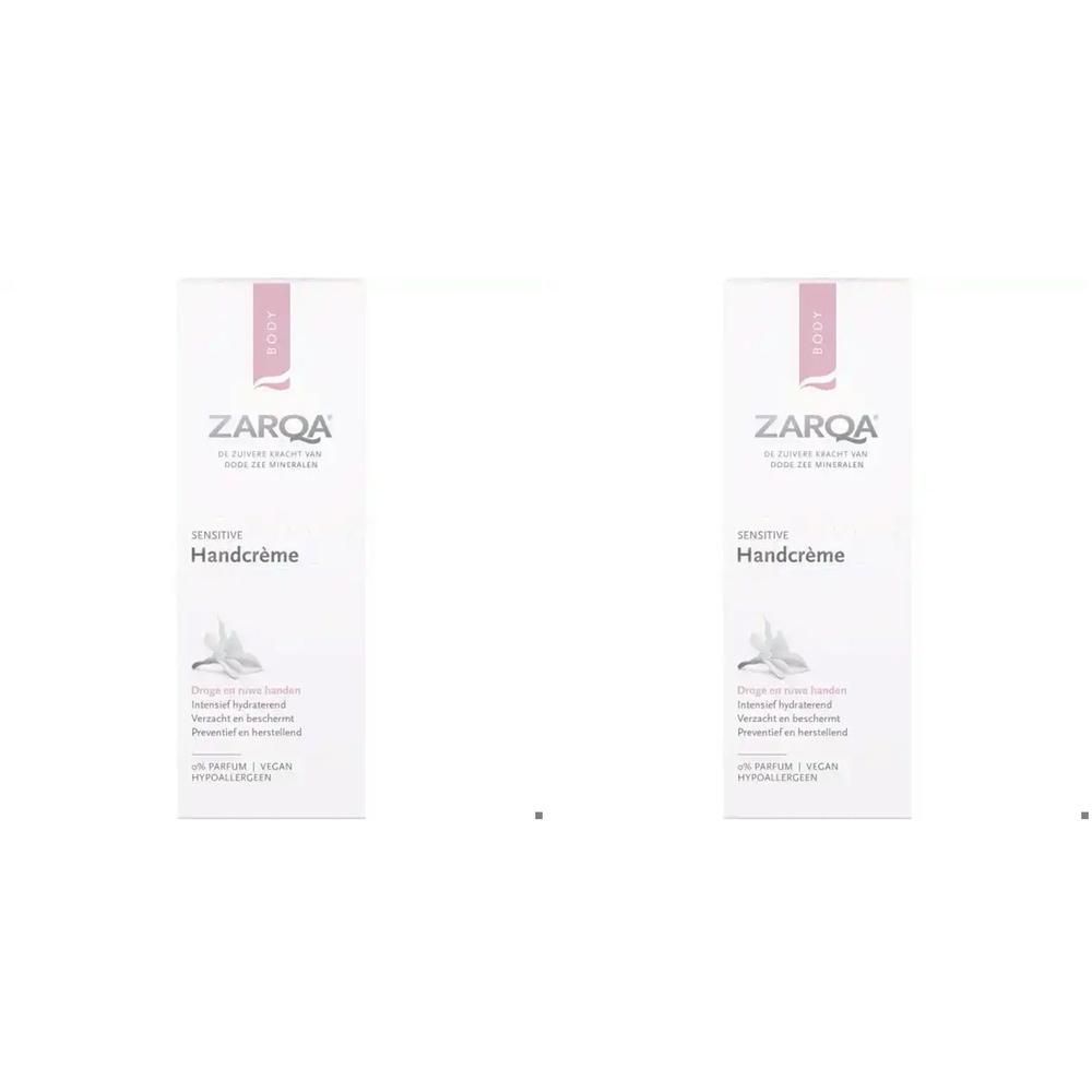 Twee verpakkingen Zarqa handcrème, wit met roze accenten. Toont een witte bloem.