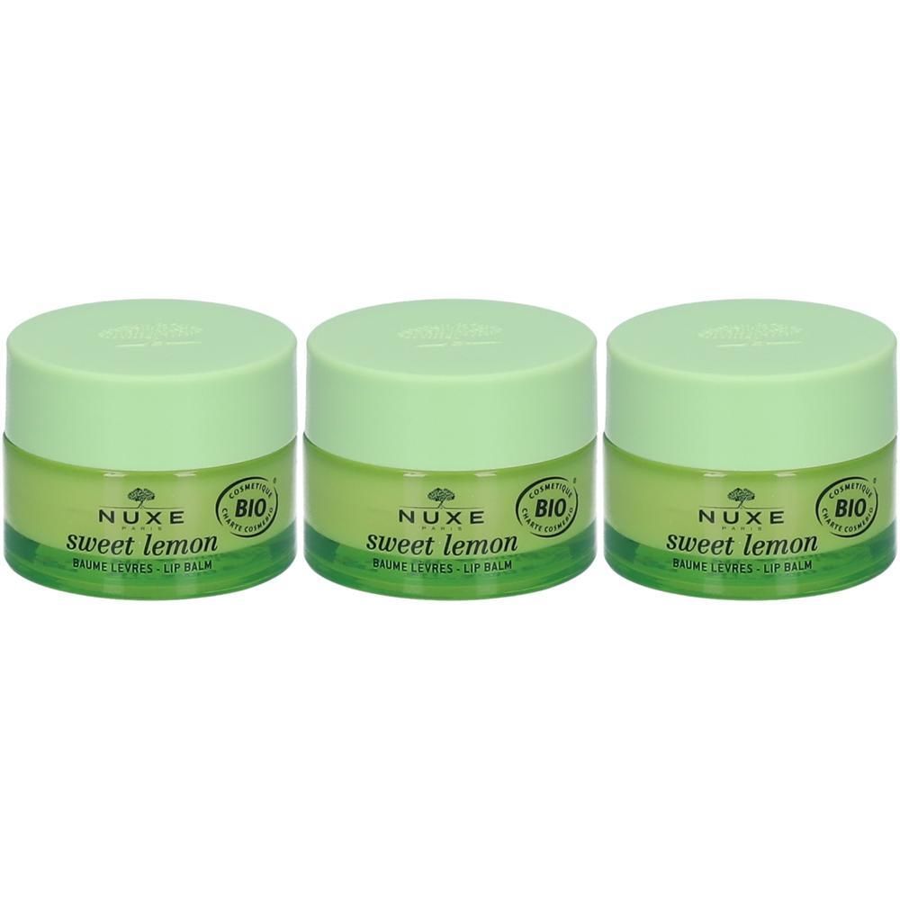 Trois pots de baume à lèvres Nuxe Sweet Lemon avec couvercles et étiquettes vert clair.