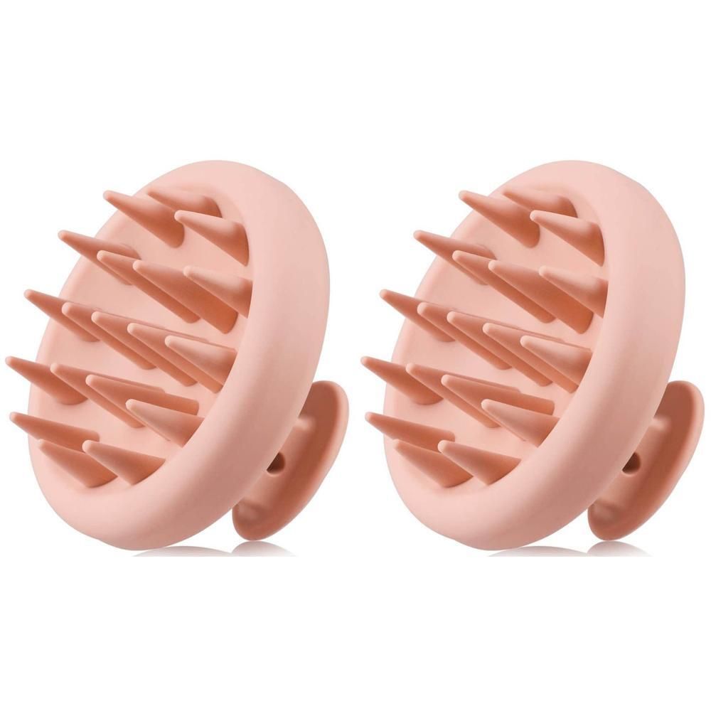 Twee roze hoofdhuidmassageborstels met flexibele siliconenpinnen.