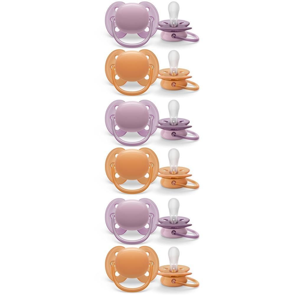 Deux paires de sucettes, une violette et une orange, chacune avec un capuchon de protection.