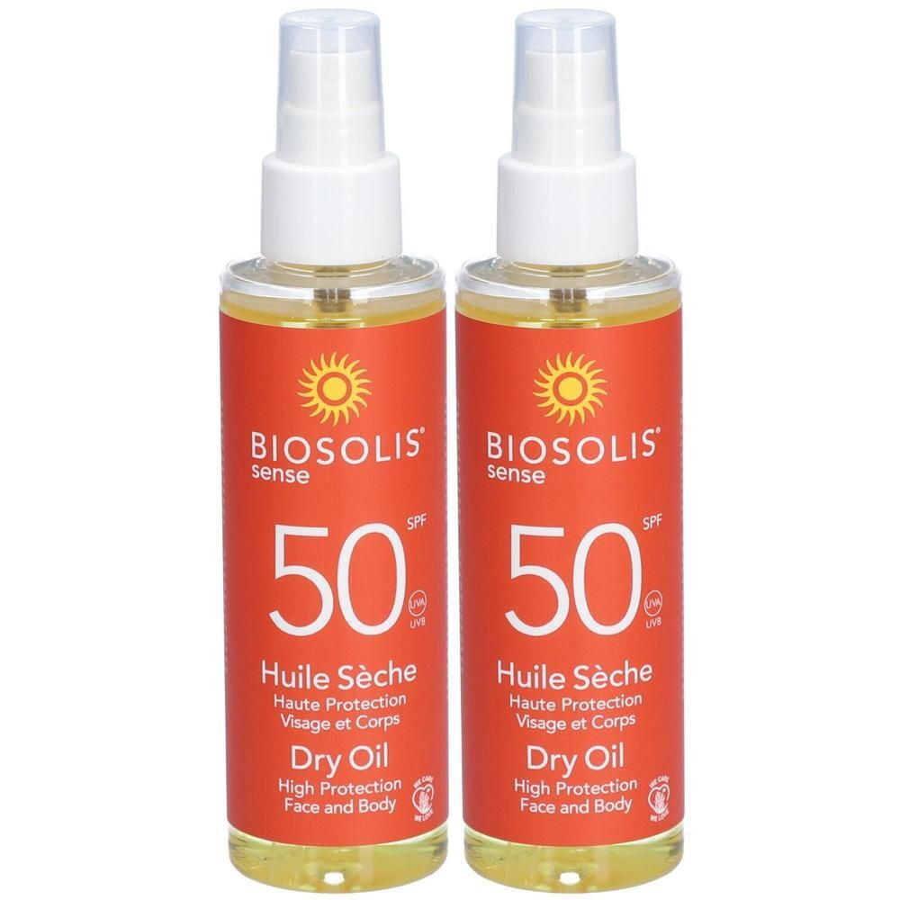 Deux flacons de Biosolis Sense Huile Sèche SPF 50. Étiquettes rouges avec symbole soleil et tête de pulvérisation blanche.