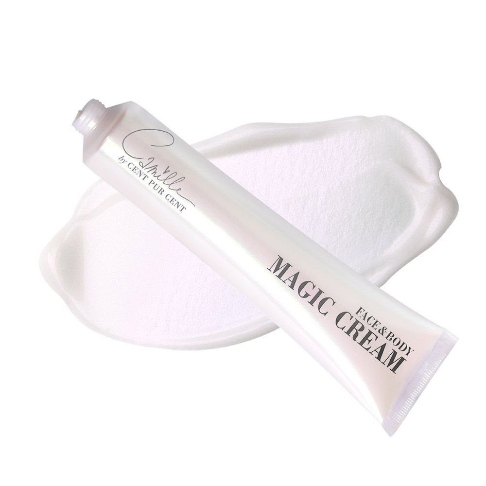 Een witte tube met zilveren dop, naast een spoor van witte crème. Opschrift: 'Camille MAGIC CREAM FACE & BODY'.