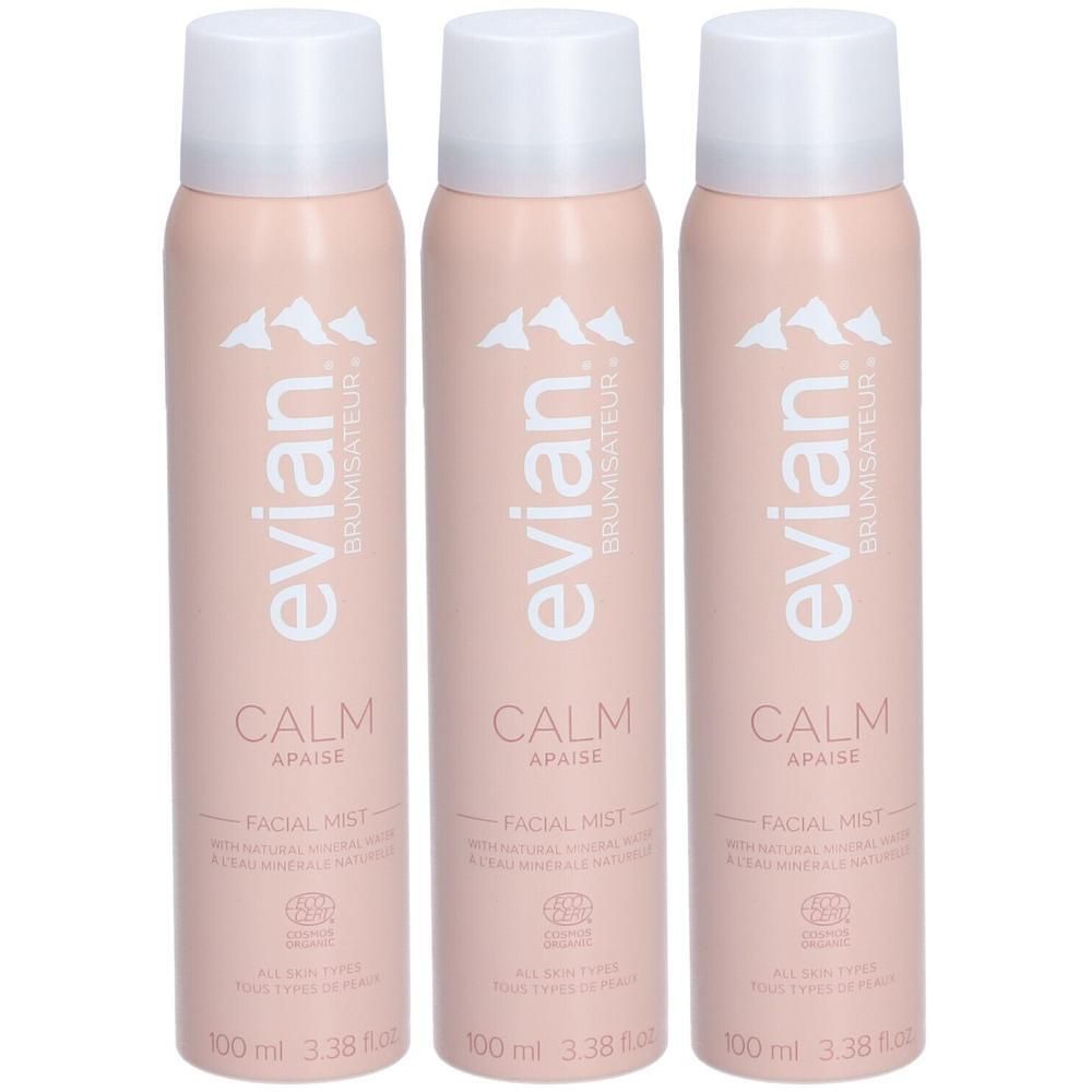 Drie roze spuitbussen Evian Brumisateur Calm Facial Mist met witte dop.