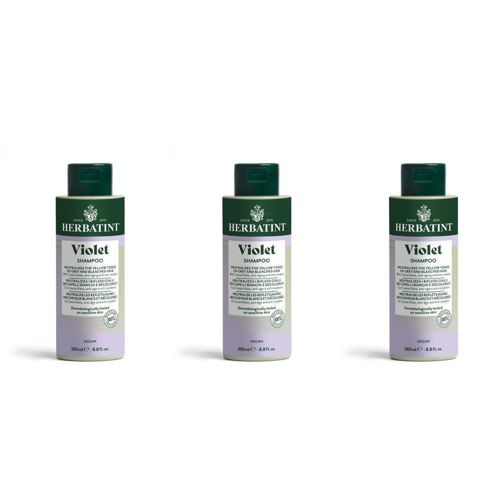 Trois bouteilles de shampooing Herbatint Violet avec bouchons verts, sur fond blanc.