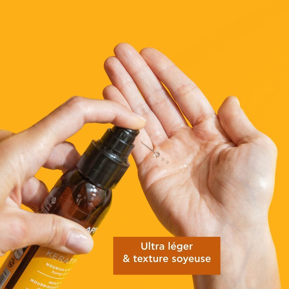 Huile Capillaire Apivita Keratin Repair dosée dans la paume.