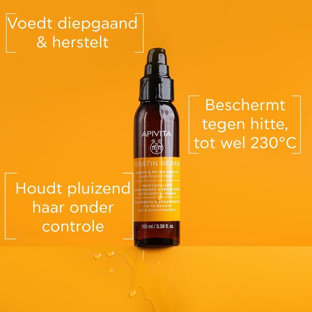 Fles Apivita Keratin Repair Haarolie met pompdispenser. Voedt, herstelt, beschermt tot 230°C.