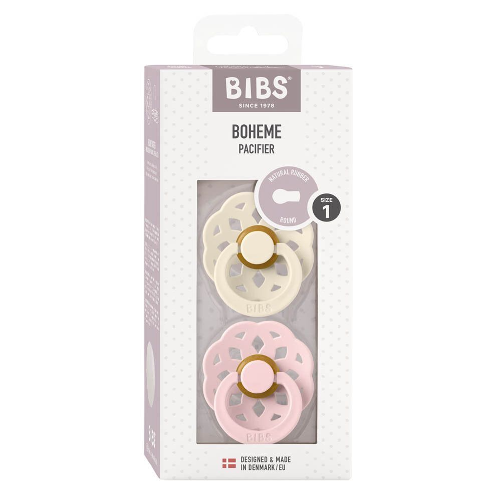 Boîte de sucettes BIBS Bohème, taille 1, avec deux sucettes : une ivoire et une rose.