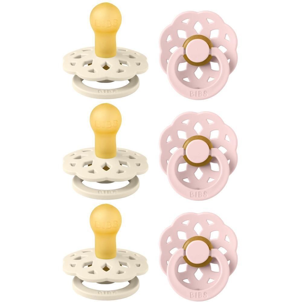 Drie crèmekleurige en drie roze fopspenen met gele speen en decoratief schild.