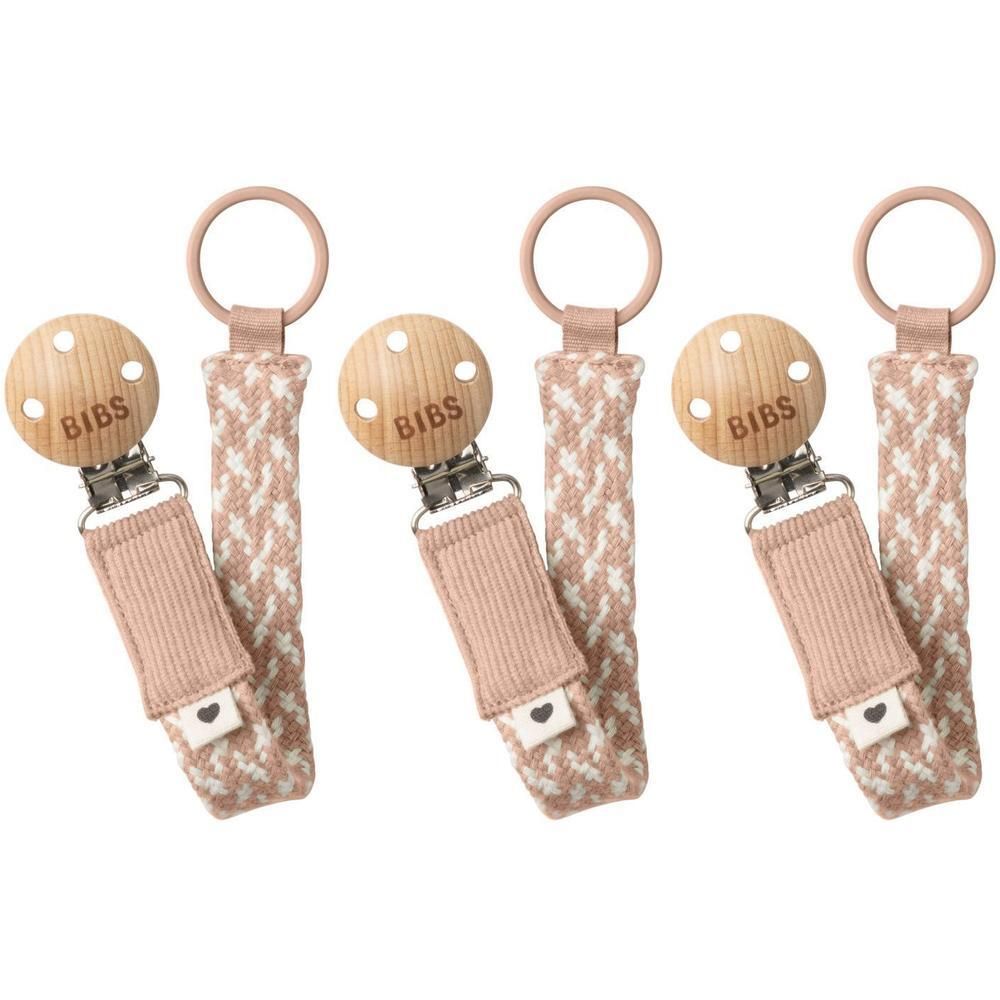 Drie BIBS fopspeenkoorden met houten ring, houten speen en roze band met wit patroon.