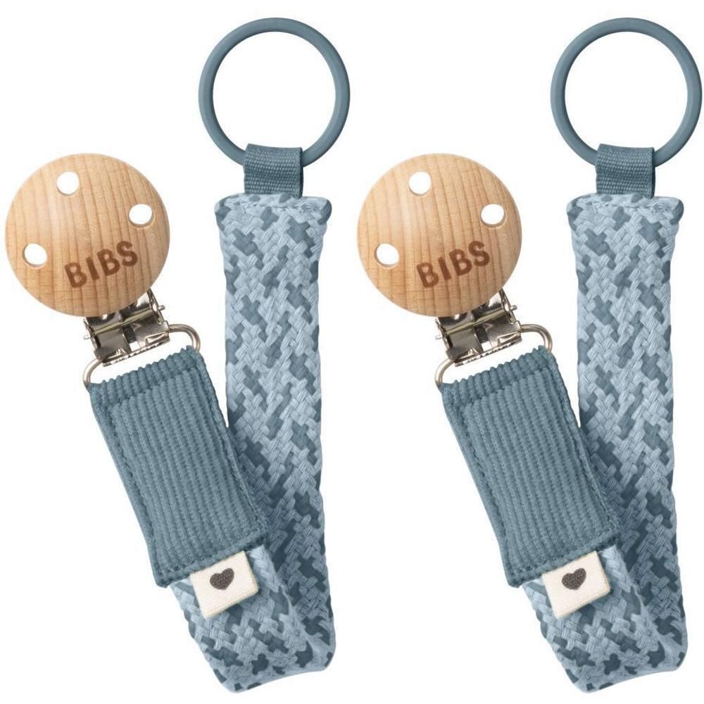 Deux attaches-sucette BIBS en bois et tissu bleu/pétrole à motif.
