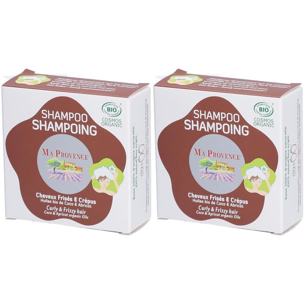 Deux boîtes de shampoing solide bio pour cheveux frisés et crépus.