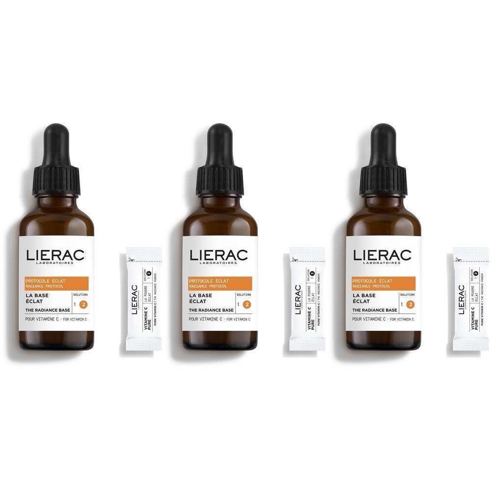 Trois sérums LIERAC Vitamine C avec pipettes et ampoules séparées de poudre de vitamine C.