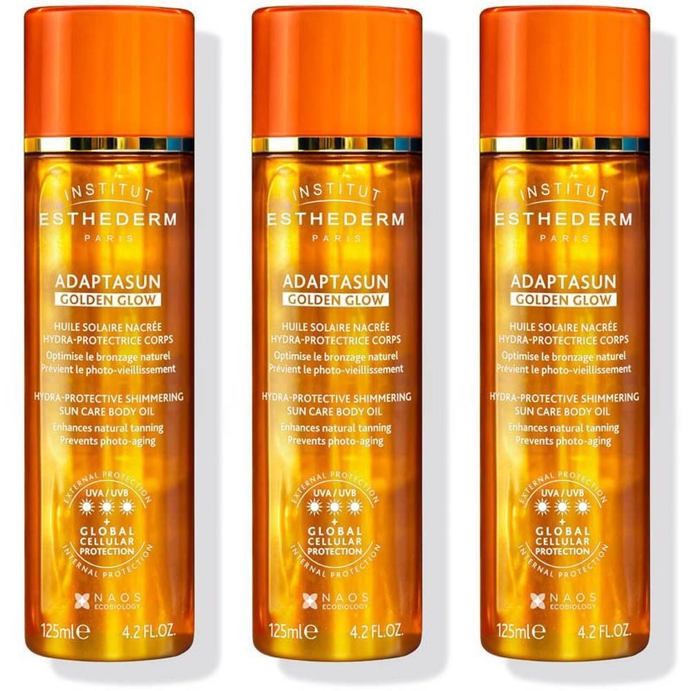 Drie flacons Institut Esthederm Golden Glow Hydra-Protecting Shimmering Sun Care Body Oil.