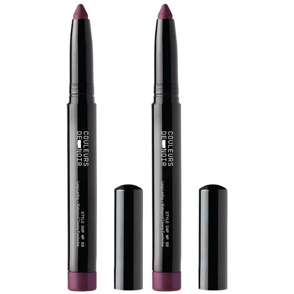 Twee paarse oogschaduwsticks met zwarte doppen. Opschrift: COULEURS DE NOIR.