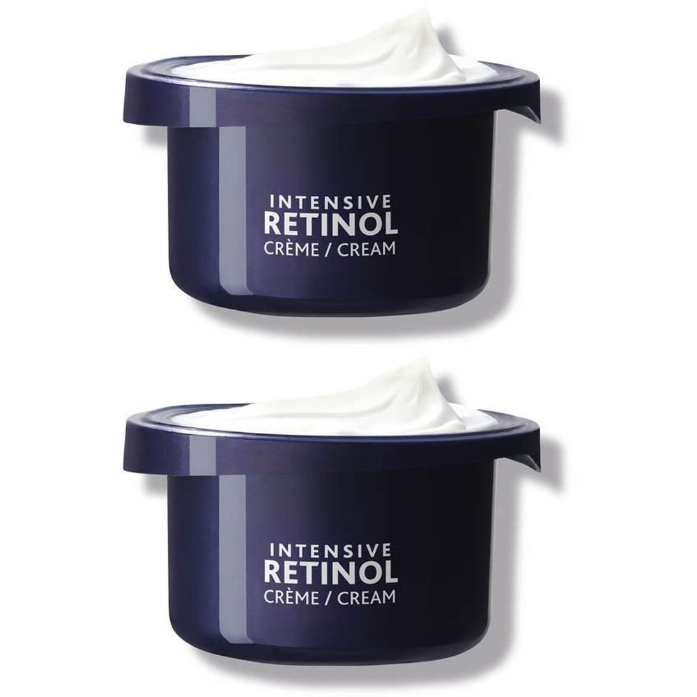 Deux pots de Crème Intensive Rétinol. Pots bleu foncé avec crème blanche.