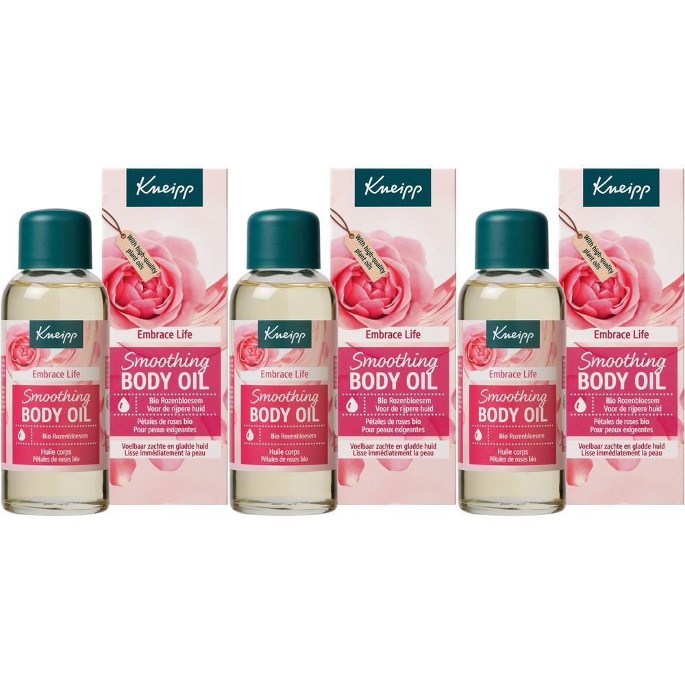 Trois flacons d'huile corporelle Kneipp avec motif de pétales de rose.