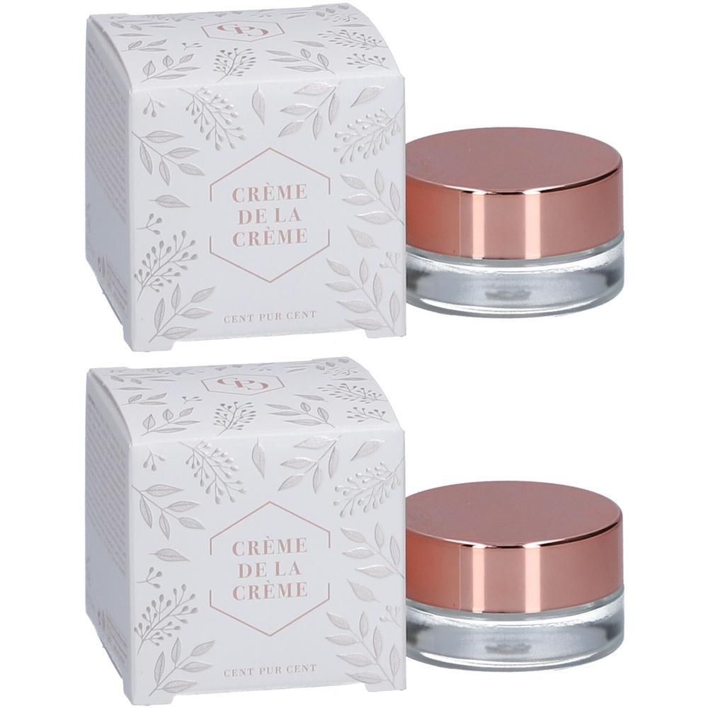 Deux pots avec couvercle rose doré et emballage blanc à motif de feuilles.