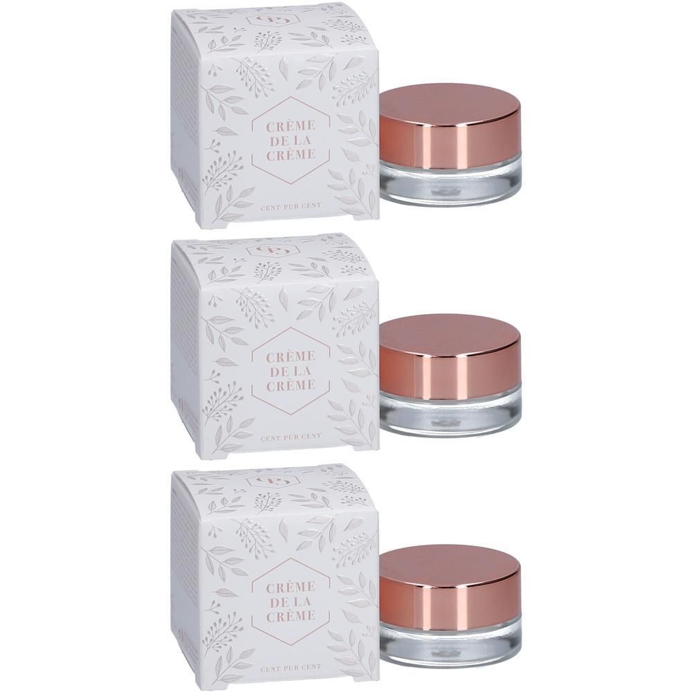 Trois pots de crème avec couvercles couleur or rose et boîtes assorties à motif de feuilles.