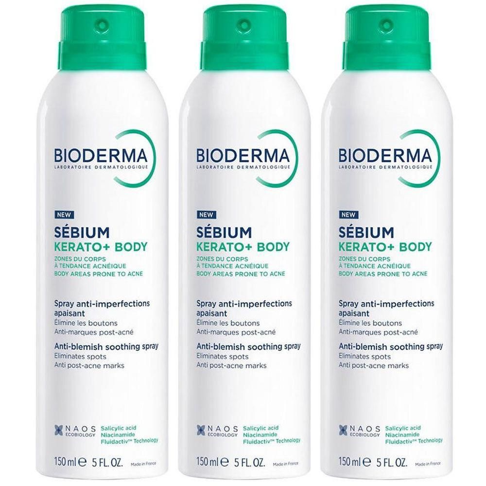 Drie Bioderma Sébium Kerato+ Body Spray flacons naast elkaar.