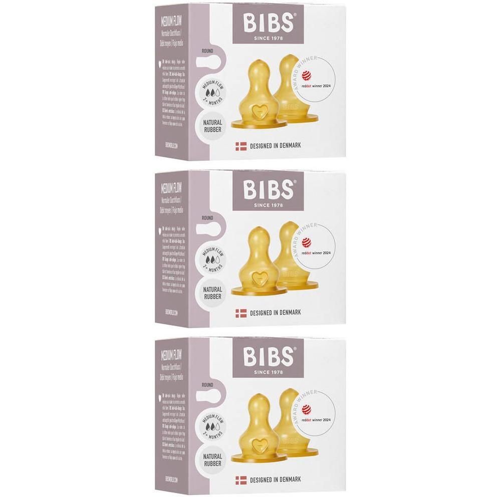 Trois paquets de tétines BIBS en caoutchouc naturel, jaunes, avec un cœur gravé.