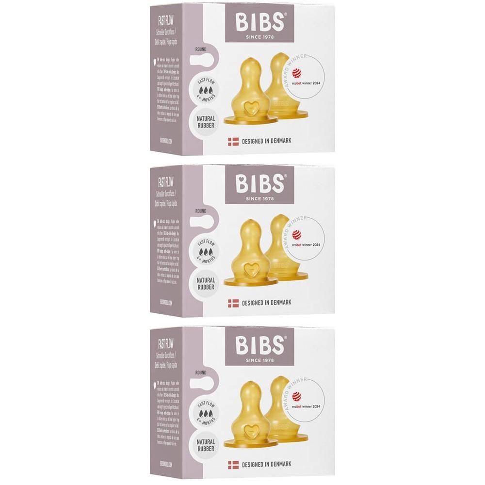 Twee BIBS spenen van natuurrubber latex, geel, met hartreliëf en "BIBS"-logo.