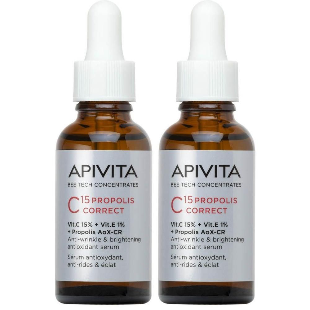 Twee flacons Apivita C15 Propolis Correct Serum met pipetten. Bruine glazen flacons met witte druppeldopjes.