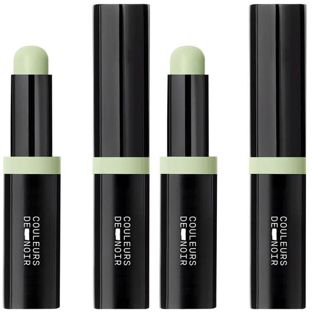 Quatre bâtons de correcteur noirs avec un anneau et une pointe vert clair.