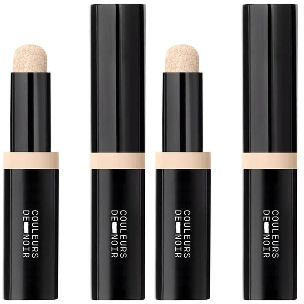 Vier zwarte sticks met lichtbeige applicator en lichtbeige band. Tekst op de sticks: COULEURS DE NOIR.