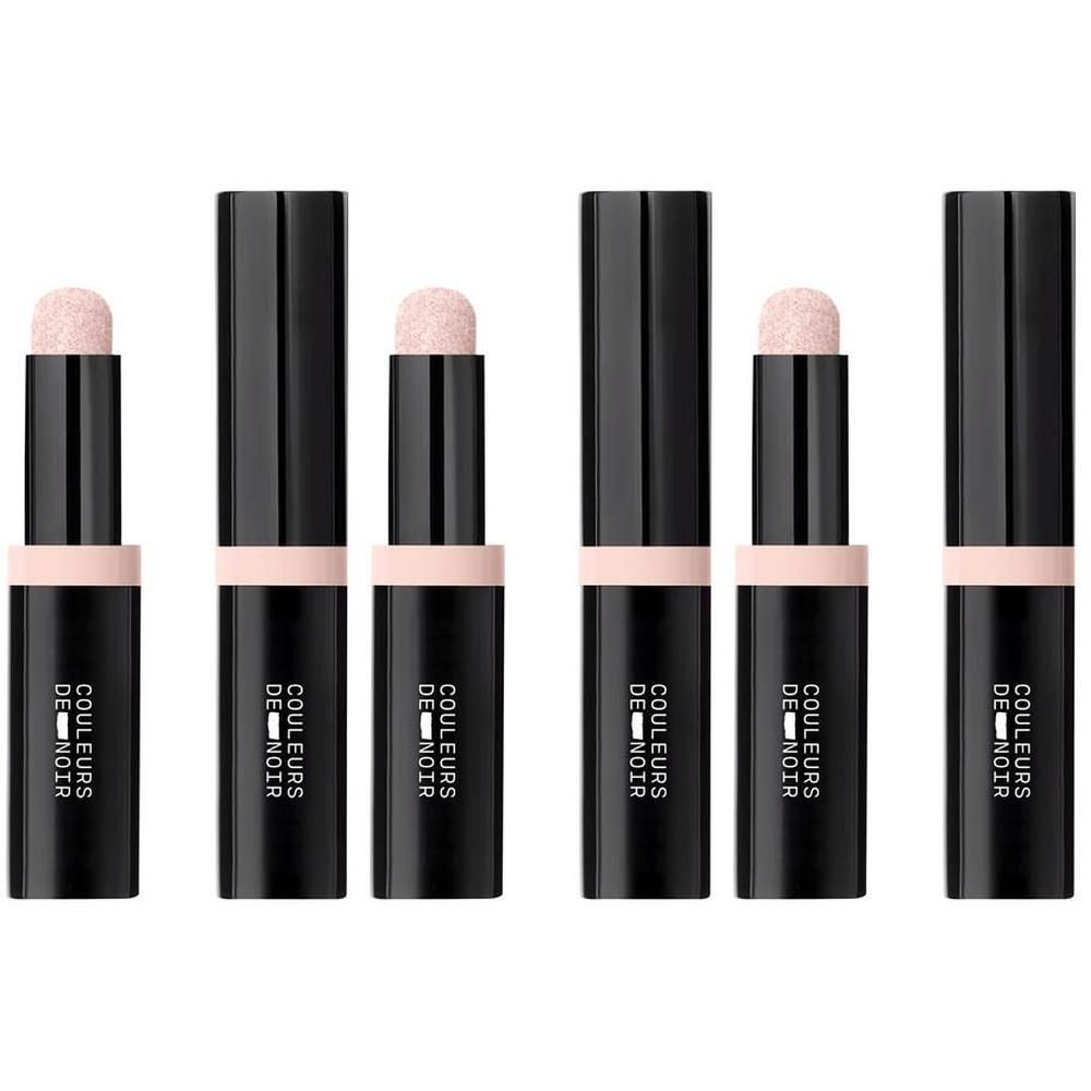 Cinq bâtons noirs avec applicateur rose pâle et bande rose pâle. Texte sur les bâtons : COULEURS DE NOIR.