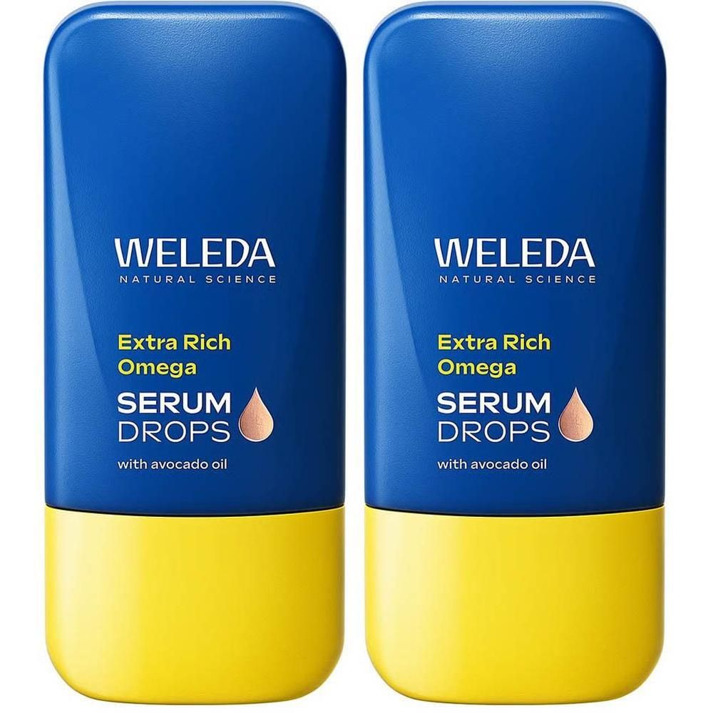 Twee flacons Weleda Omega Boost Serum Drops met avocado-olie. Blauwe bovenkant, gele onderkant.