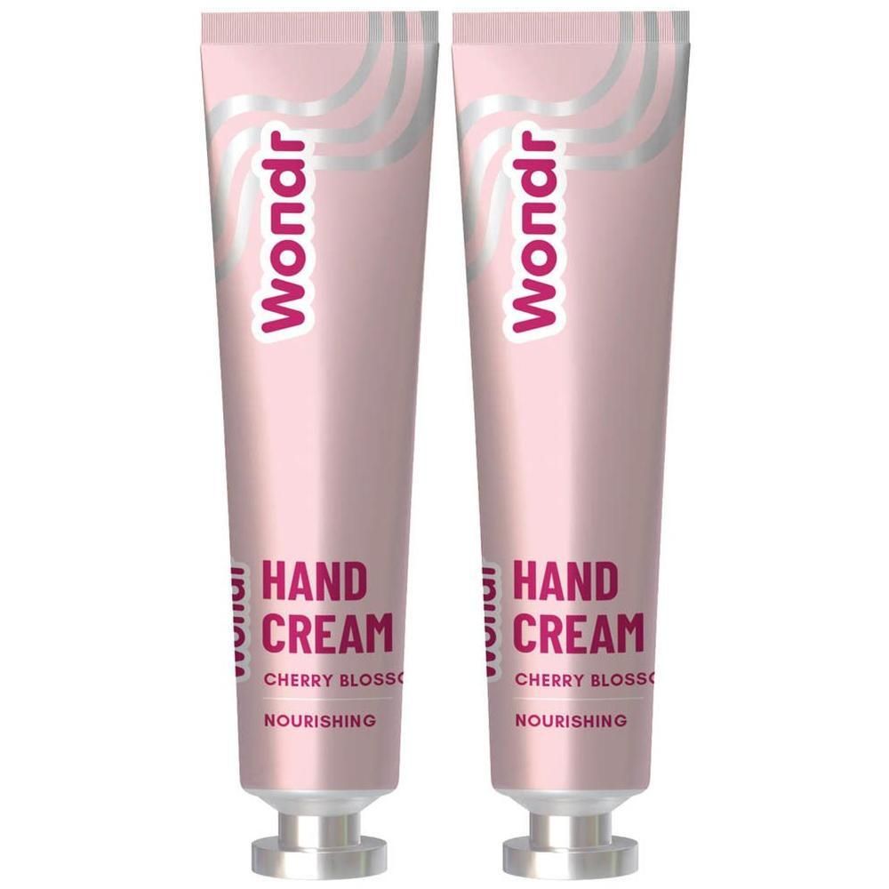 Deux tubes roses de crème pour les mains 'Wondr Hand Cream Cherry Blossom Nourishing'.