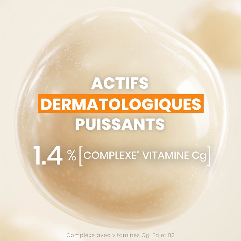Gros plan d'une bulle avec texte : Actifs dermatologiques, 1.4% Vitamine Cg.