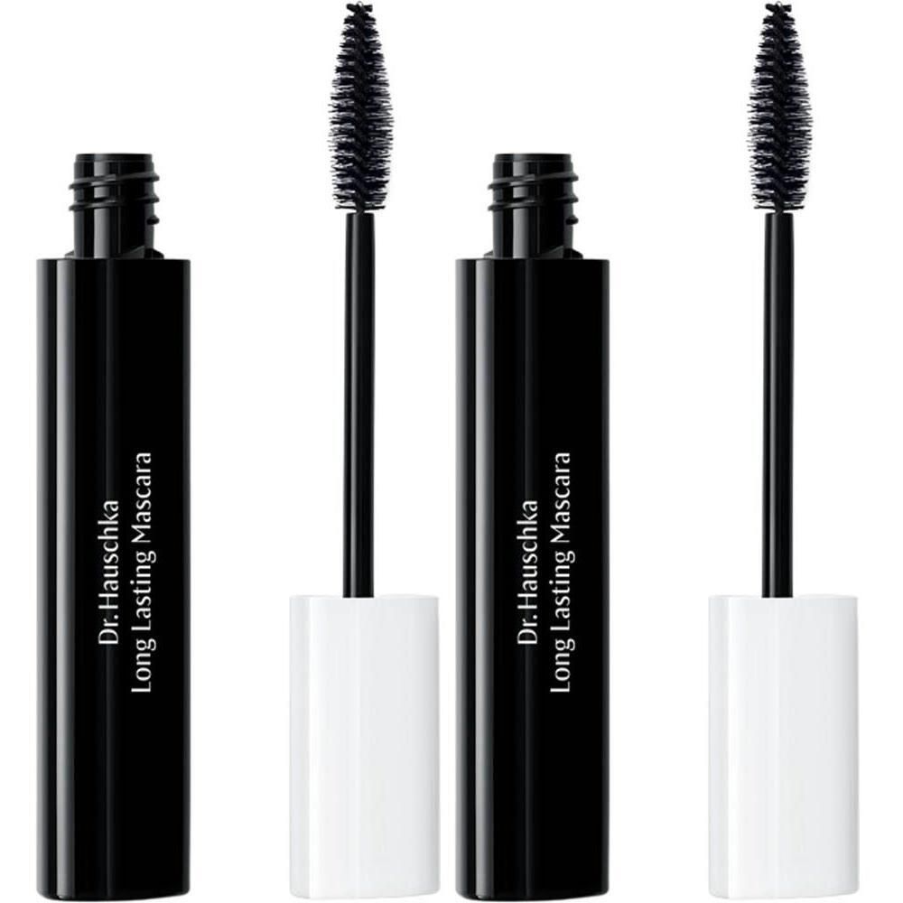 Twee zwarte mascaraflacons met witte doppen en borstels. Dr. Hauschka Long Lasting Mascara.