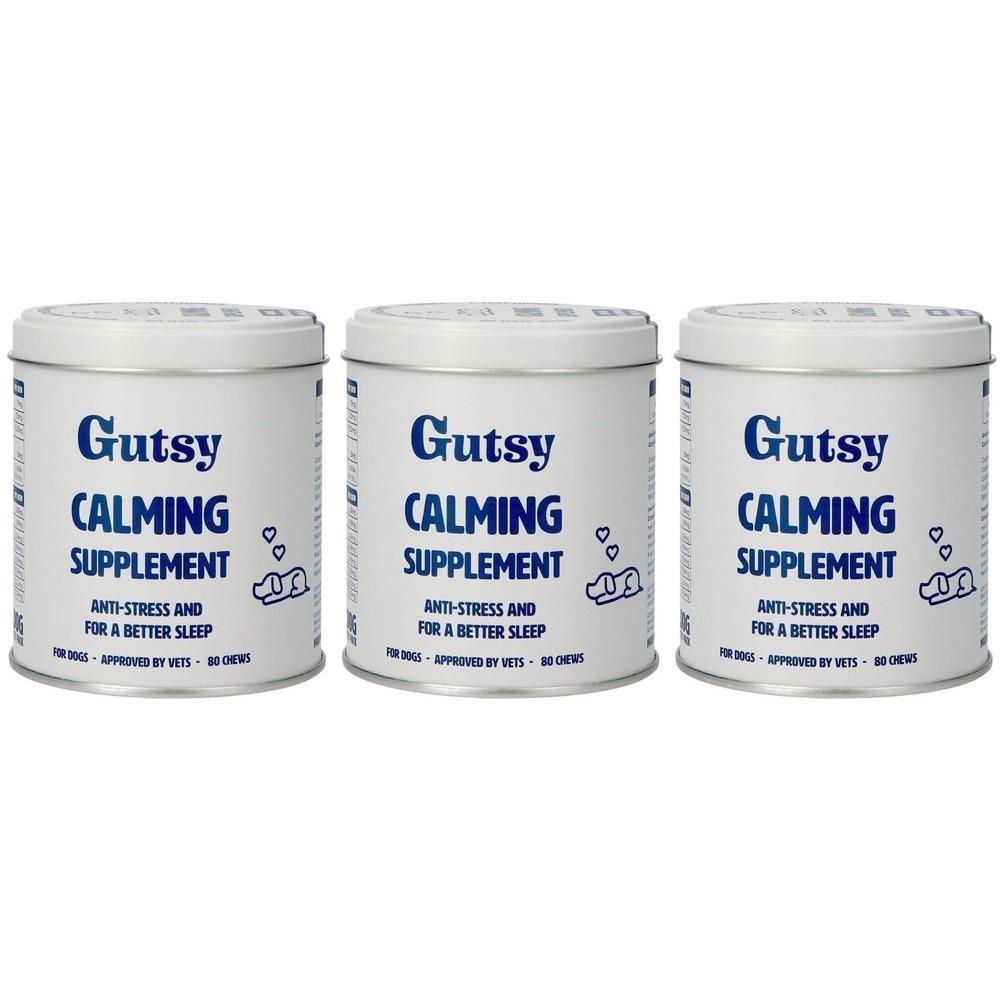 Trois boîtes de Gutsy Complément Calmant pour chiens, blanc avec inscription bleue.