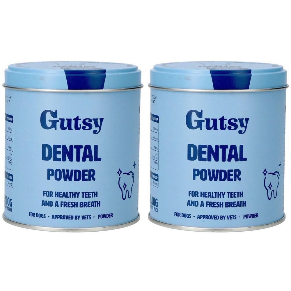 Deux boîtes bleues claires de Gutsy Dental Powder pour chiens. Inscriptions en allemand et anglais.