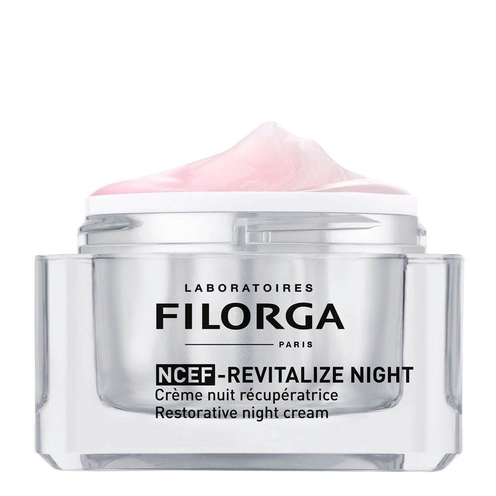 Un pot de crème nuit Filorga NCEF-REVITALIZE avec texture rose.