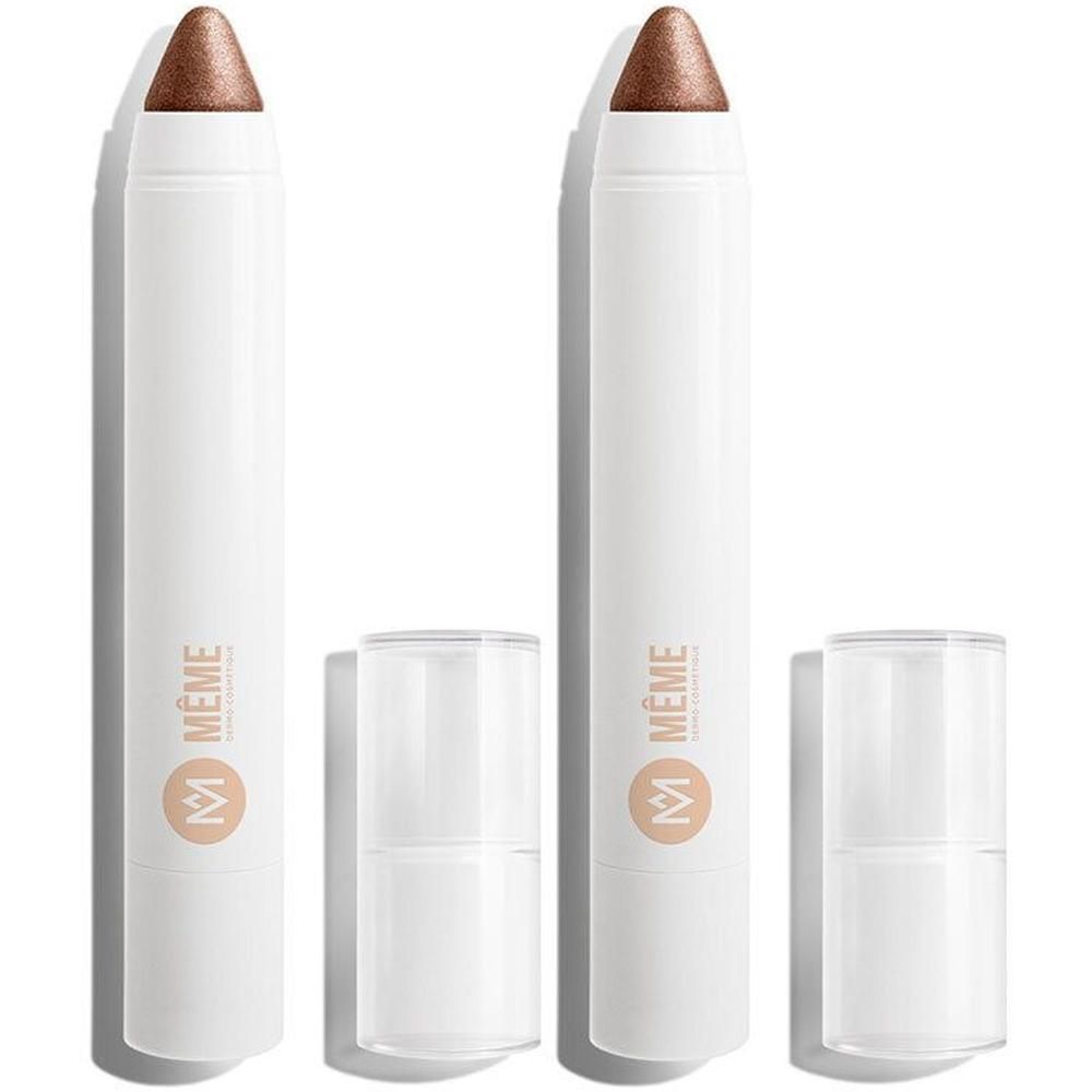 Deux crayons à paupières blancs avec pointe bronze et logo argenté.