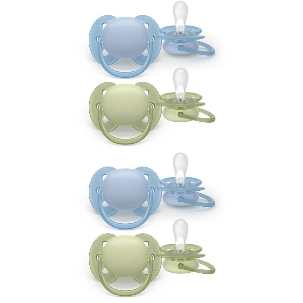 Quatre sucettes : deux bleu clair et deux vert clair. Toutes avec tétine transparente et capuchon de protection.
