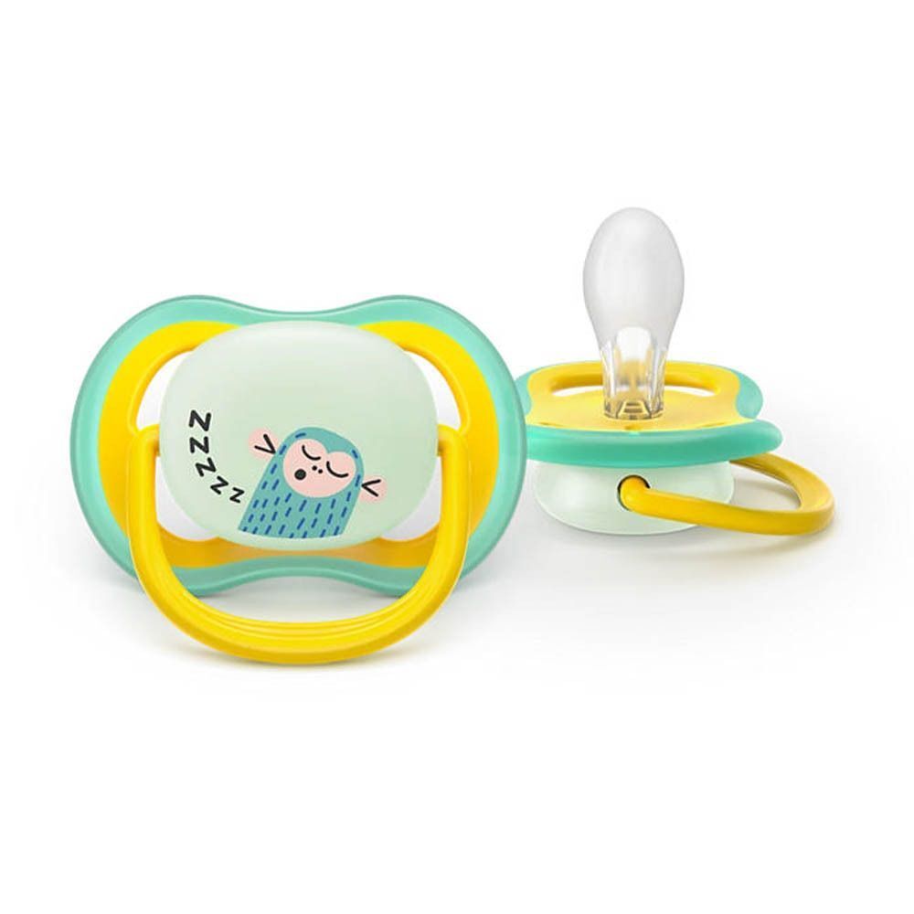 Une sucette Philips Avent avec motif hibou en vert clair, jaune et bleu clair.