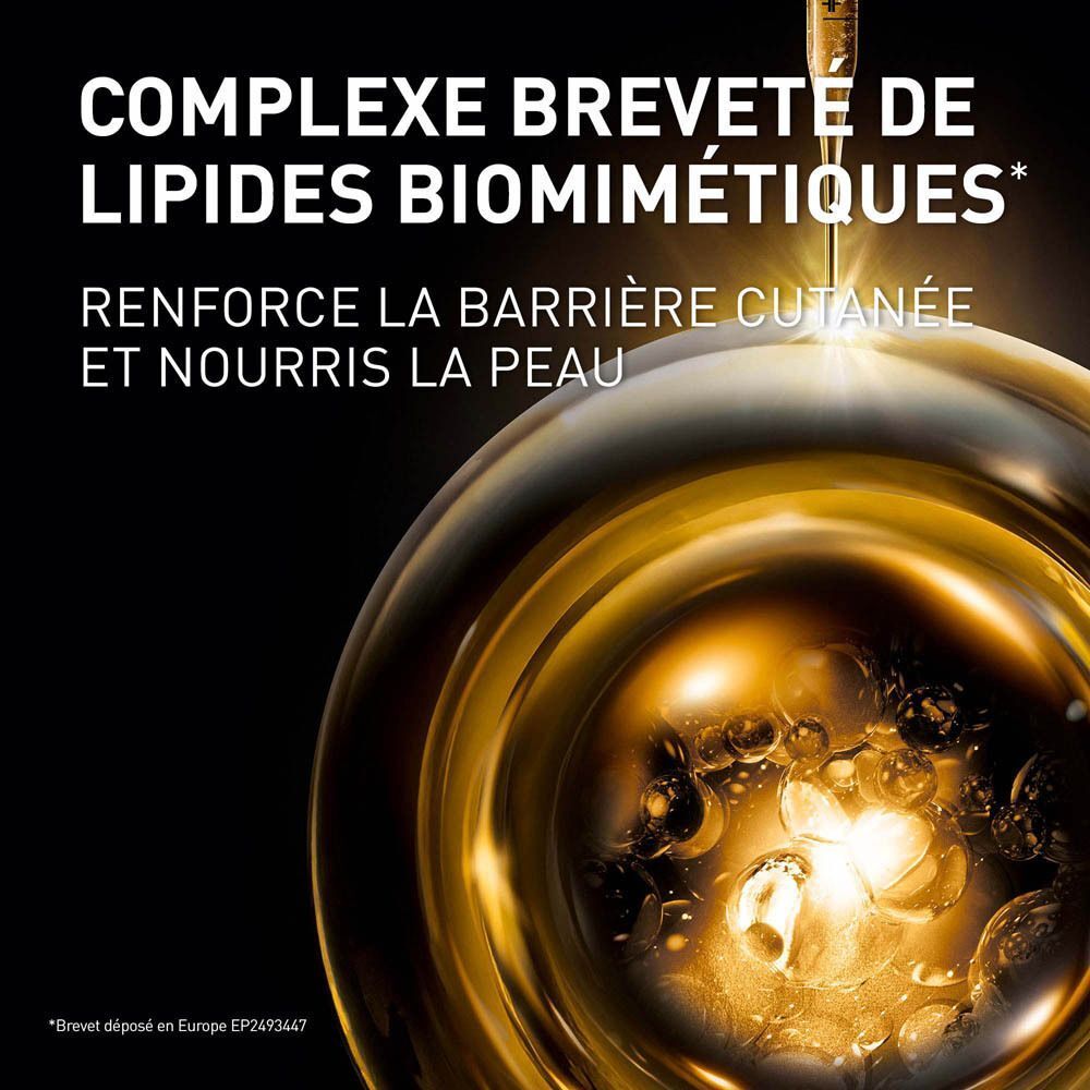 Goutte de sérum doré dans une sphère avec l'inscription "COMPLEXE BREVETÉ DE LIPIDES BIOMIMÉTIQUES".