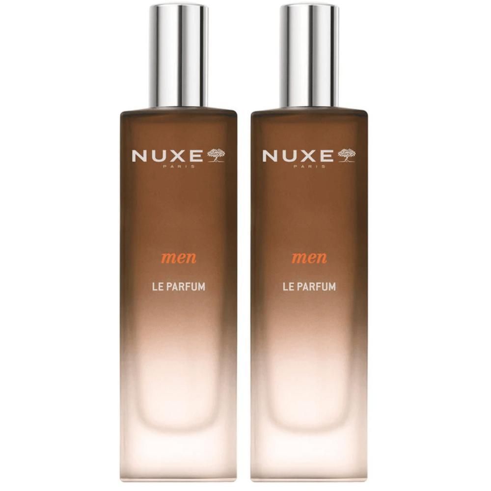 Twee NUXE Men Le Parfum flacons met zilveren doppen en bruine kleurverloop.
